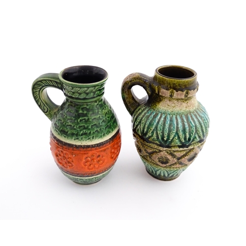 232 - Two West German Bay vases with single handle, one with a green glaze, tope twist detail and orange b... 