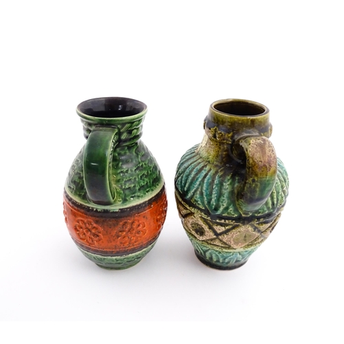 232 - Two West German Bay vases with single handle, one with a green glaze, tope twist detail and orange b... 