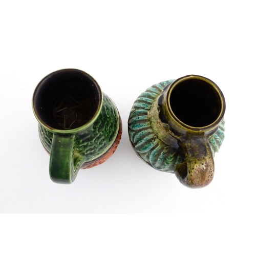 232 - Two West German Bay vases with single handle, one with a green glaze, tope twist detail and orange b... 