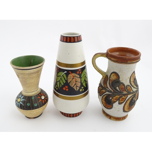 235 - Three West German vases to include a Dumler & Breiden vase with banded leaf detail, a Marei vase wit... 