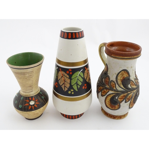 235 - Three West German vases to include a Dumler & Breiden vase with banded leaf detail, a Marei vase wit... 