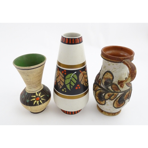 235 - Three West German vases to include a Dumler & Breiden vase with banded leaf detail, a Marei vase wit... 