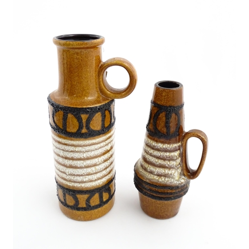 239 - Two West German Scheurich vases each with a single loop handle, both decorated with banded detail. M... 