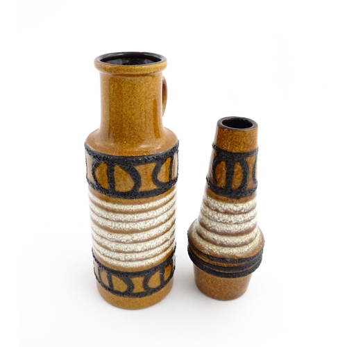 239 - Two West German Scheurich vases each with a single loop handle, both decorated with banded detail. M... 