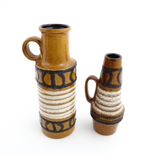 239 - Two West German Scheurich vases each with a single loop handle, both decorated with banded detail. M... 