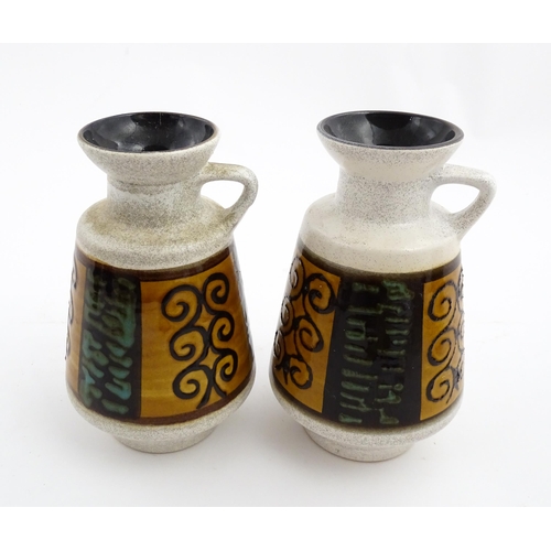 240 - A pair of West German Dumler & Breiden vases with single handle and banded scrolling decoration. Lar... 