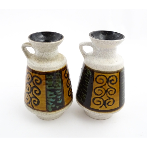 240 - A pair of West German Dumler & Breiden vases with single handle and banded scrolling decoration. Lar... 