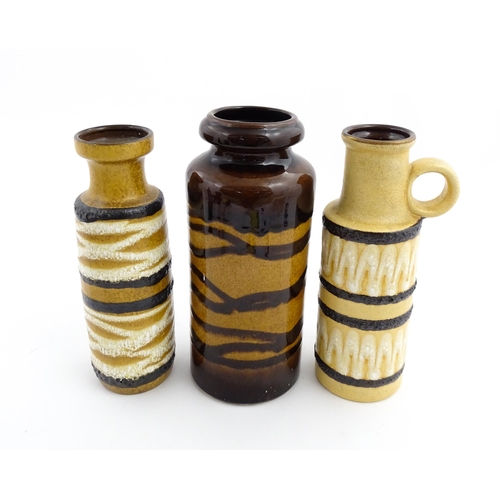 242 - Three West German Scheurich vases to include an example with a single loop handle, each decorated wi... 