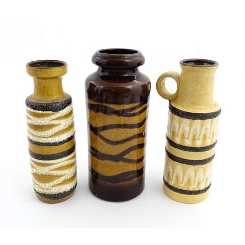 242 - Three West German Scheurich vases to include an example with a single loop handle, each decorated wi... 