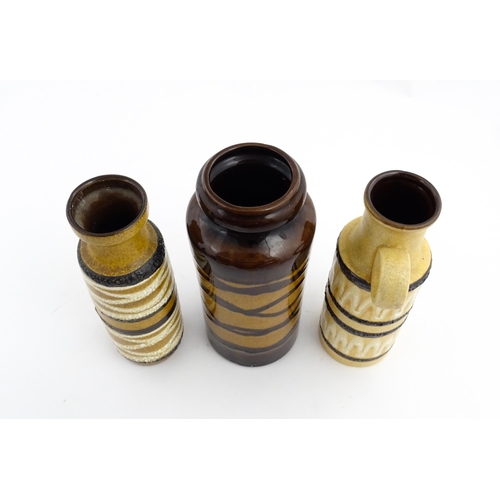 242 - Three West German Scheurich vases to include an example with a single loop handle, each decorated wi... 