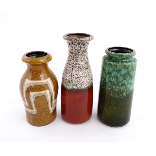 245 - Three West German Scheurich vases to include an example with a flared rim, mottle glaze and crimson ... 