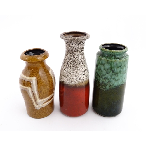 245 - Three West German Scheurich vases to include an example with a flared rim, mottle glaze and crimson ... 