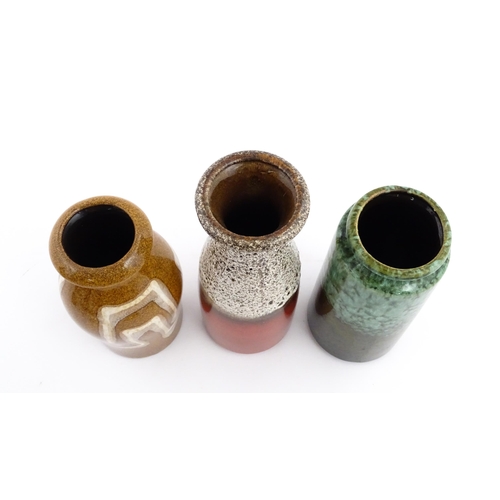 245 - Three West German Scheurich vases to include an example with a flared rim, mottle glaze and crimson ... 