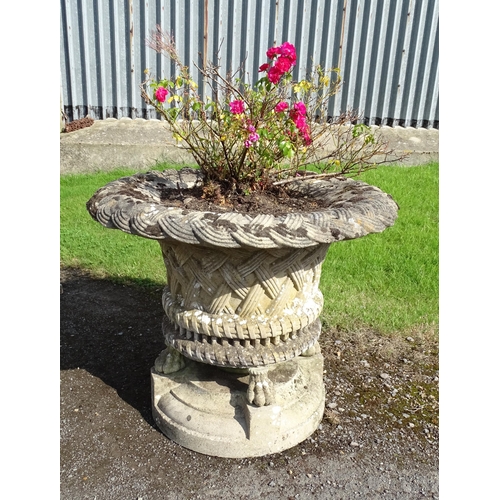 822 - Garden / Architectural : a large 19thC ornate stone urn planter, the upper section with weaved decor... 