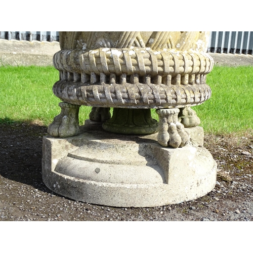 822 - Garden / Architectural : a large 19thC ornate stone urn planter, the upper section with weaved decor... 