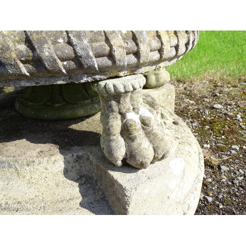 822 - Garden / Architectural : a large 19thC ornate stone urn planter, the upper section with weaved decor... 