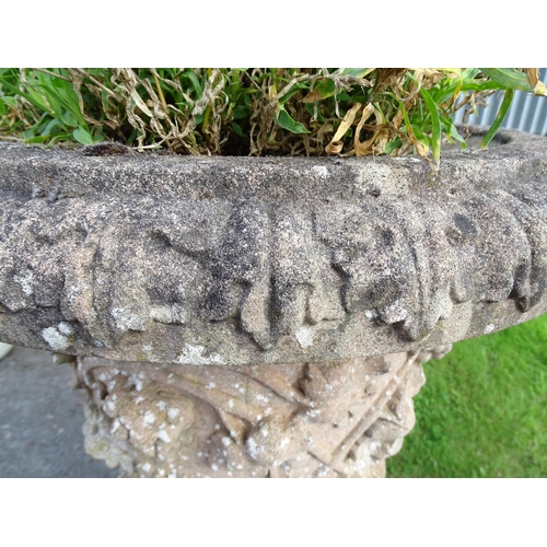 823 - Garden / Architectural: a large 19thC ornate stone urn planter, of classical form with fruiting vine... 