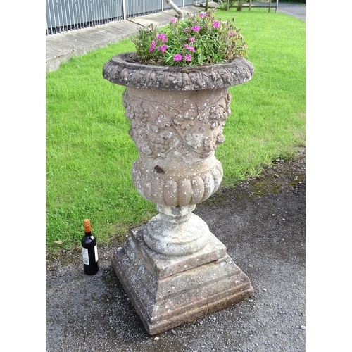 823 - Garden / Architectural: a large 19thC ornate stone urn planter, of classical form with fruiting vine... 