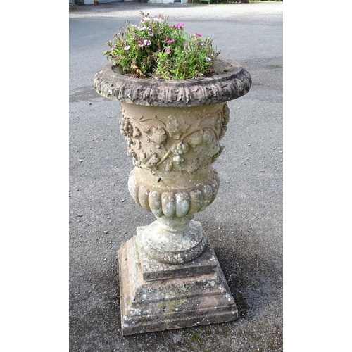 823 - Garden / Architectural: a large 19thC ornate stone urn planter, of classical form with fruiting vine... 