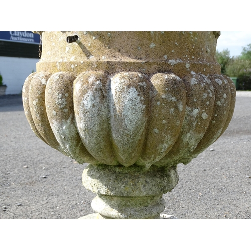 823 - Garden / Architectural: a large 19thC ornate stone urn planter, of classical form with fruiting vine... 