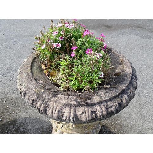 823 - Garden / Architectural: a large 19thC ornate stone urn planter, of classical form with fruiting vine... 