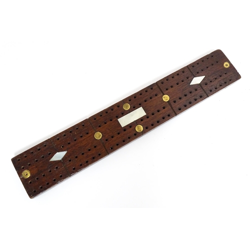 857 - Toys: Three cribbage boards comprising one with a copper mount decorated with flowers, one with inla... 