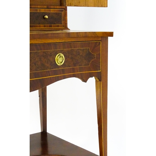 1437 - A 19thC Bonheur du jour, the top having marquetry inlaid doors that open to show three short drawers... 