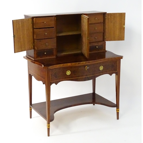 1437 - A 19thC Bonheur du jour, the top having marquetry inlaid doors that open to show three short drawers... 