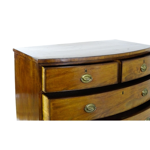 1439 - A 19thC bow fronted mahogany chest of drawers comprising two short over three long drawers raised on... 