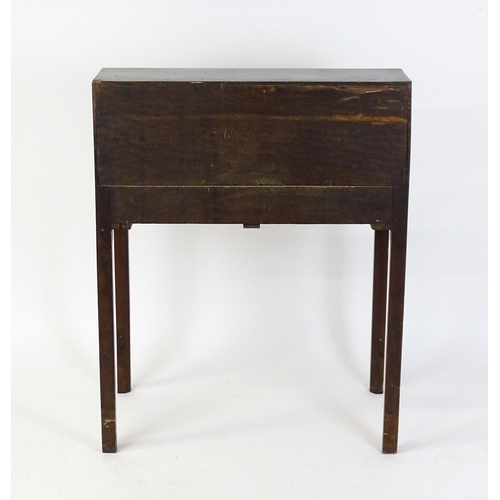 1562 - A late 18thC oak clerks desk with a fall front above two short drawers with swan neck handles and ra... 