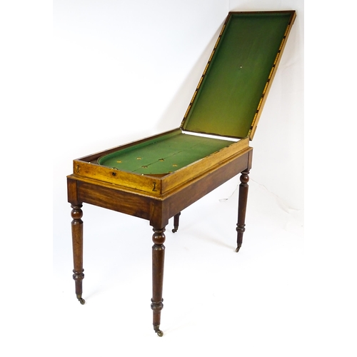 1563 - A Victorian bagatelle on stand raised on four turned tapering legs terminating in brass castors. 50