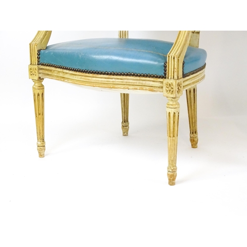 1574 - A pair of 20thC French Louis XVI armchairs, surmounted by turned finials and having gold tooled leat... 