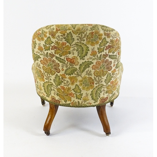 1578 - A mid / late 19thC nursing chair with floral upholstery raised on turned tapering legs terminating i... 