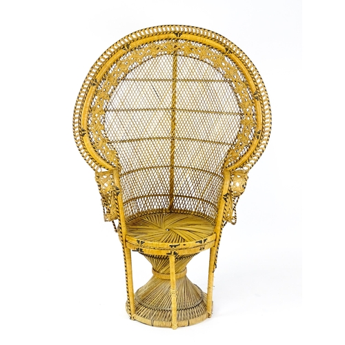 1585 - A 20thC peacock chair of rattan construction. 37