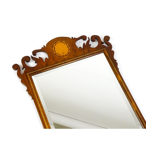 1586 - A Regency style yew wood veneered wall mirror inlaid with marquetry decoration. 20