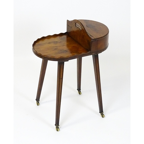 1623 - A 19thC yew wood cutlery stand / butlers Canterbury with a hinged lid, pierced handle and raised on ... 