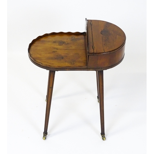 1623 - A 19thC yew wood cutlery stand / butlers Canterbury with a hinged lid, pierced handle and raised on ... 