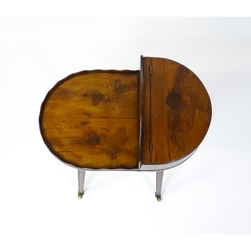 1623 - A 19thC yew wood cutlery stand / butlers Canterbury with a hinged lid, pierced handle and raised on ... 