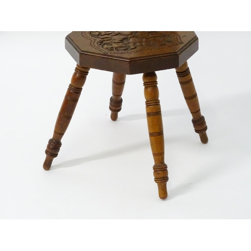 1624 - A late 19thC / early 20thC oak spinners chair with floral carved decoration and a pierced heart hand... 