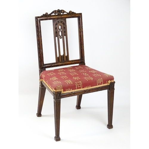 1627 - An Edwardian mahogany side chair with a floral carved cresting rail above a central pierced back spl... 