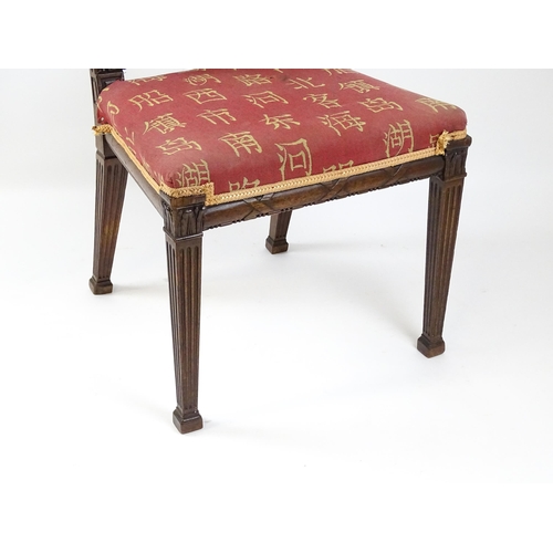 1627 - An Edwardian mahogany side chair with a floral carved cresting rail above a central pierced back spl... 