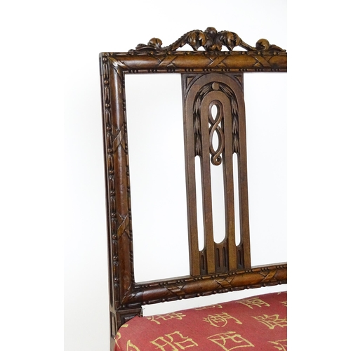 1627 - An Edwardian mahogany side chair with a floral carved cresting rail above a central pierced back spl... 