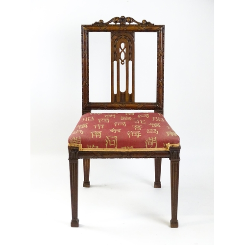 1627 - An Edwardian mahogany side chair with a floral carved cresting rail above a central pierced back spl... 