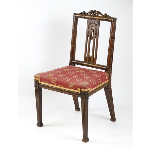 1627 - An Edwardian mahogany side chair with a floral carved cresting rail above a central pierced back spl... 