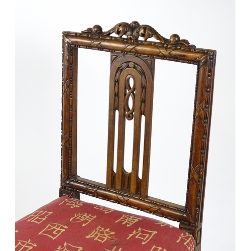 1627 - An Edwardian mahogany side chair with a floral carved cresting rail above a central pierced back spl... 