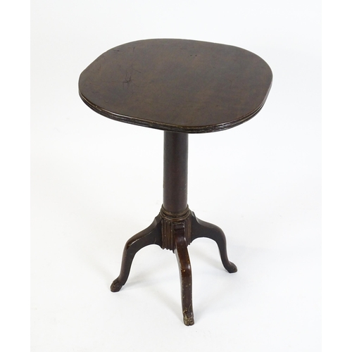 1634 - A 19thC mahogany occasional table with a reeded top above a turned pedestal and four cabriole legs. ... 