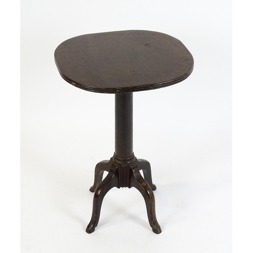 1634 - A 19thC mahogany occasional table with a reeded top above a turned pedestal and four cabriole legs. ... 