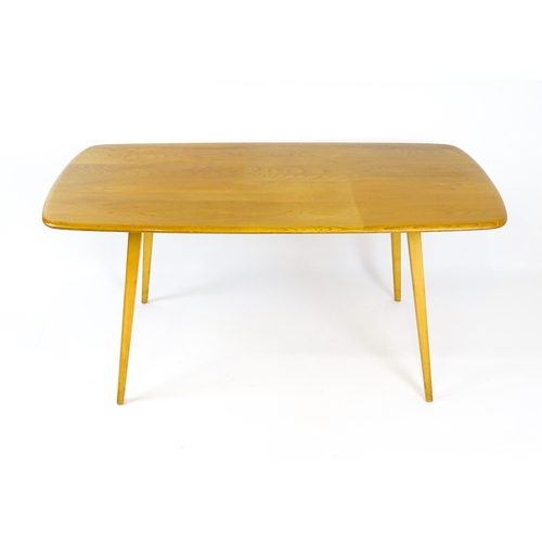 1649 - Vintage / Retro: An elm Ercol dining table raised on four tapering legs. 60