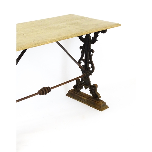 820 - Garden / Architectural: A late 19thC / early 20thC table with a cast iron base. 44