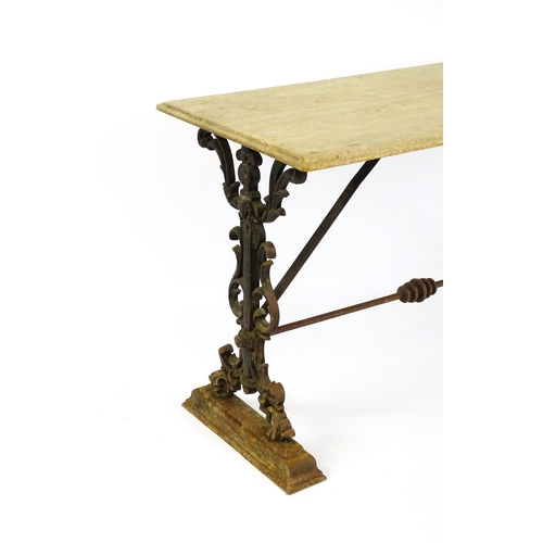 820 - Garden / Architectural: A late 19thC / early 20thC table with a cast iron base. 44